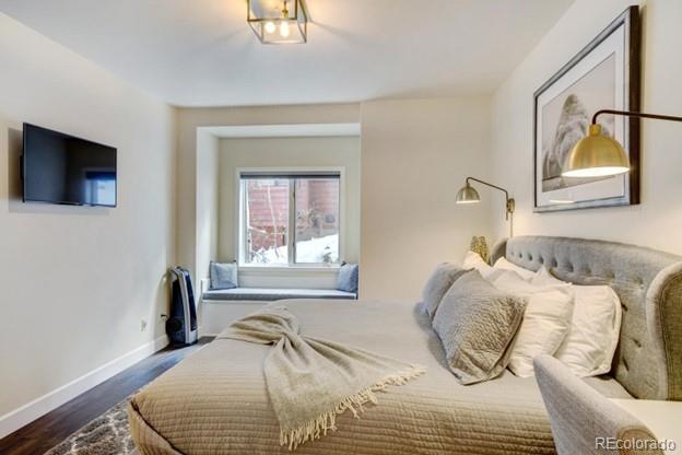 97 Kinney Way, Unit A Winter Park, CO 80482 - Photo 12 of 27 a bedroom with a bed and a window