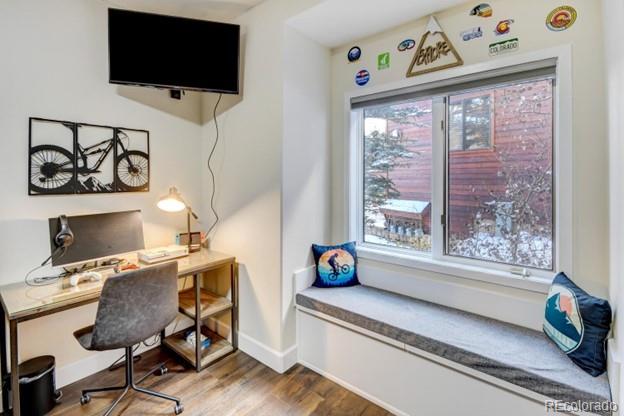 97 Kinney Way, Unit A Winter Park, CO 80482 - Photo 19 of 27 a view of a workspace with furniture and a window