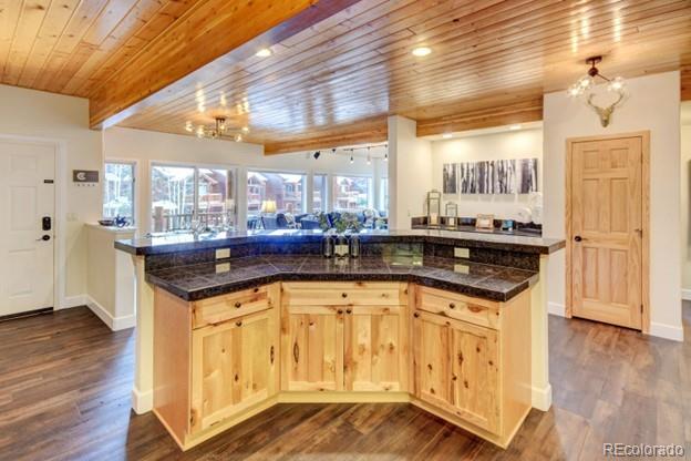 97 Kinney Way, Unit A Winter Park, CO 80482 - Photo 7 of 27 a kitchen with granite countertop a sink and cabinets