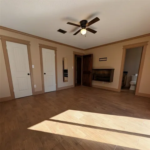 a living room with a flat screen tv and a fireplace