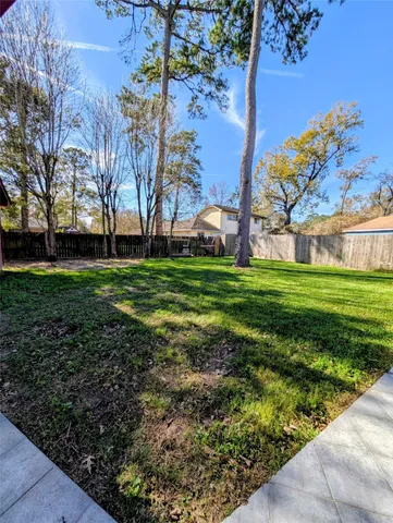a backyard of a house with lots of green space