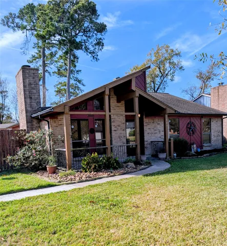 a view of a house with swimming pool and a yard