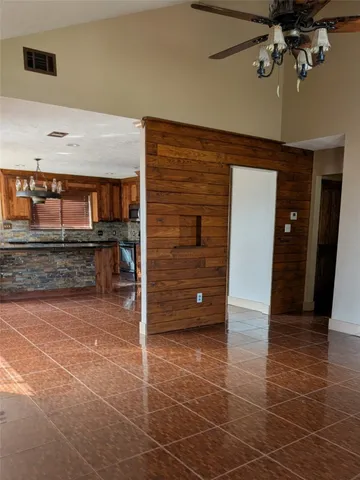 a view of a livingroom with furniture and staircase
