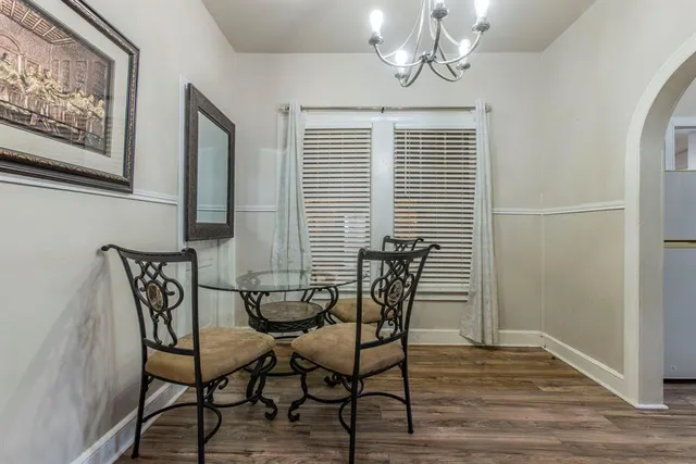 a view of a livingroom with furniture and wooden floor