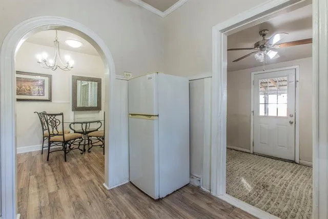 a kitchen with stainless steel appliances granite countertop a sink and a refrigerator