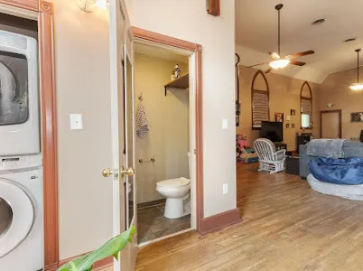 a bathroom with a toilet a sink and a shower