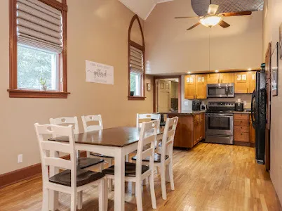 a view of a dining room with furniture and wooden floor