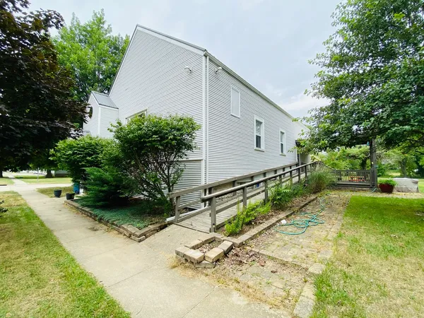a view of a house with a yard