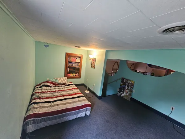a bedroom with a bed and cabinets