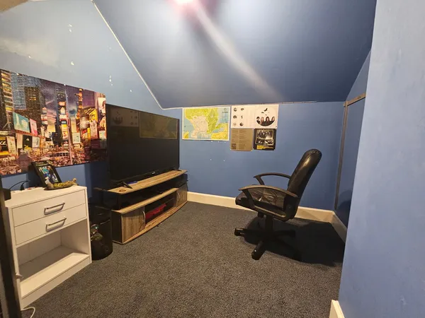 a view of workspace with lounge chair