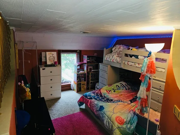 walk in closet with clothes and shoes