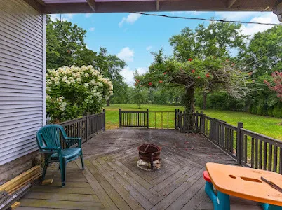 a view of a chairs and table on the deck