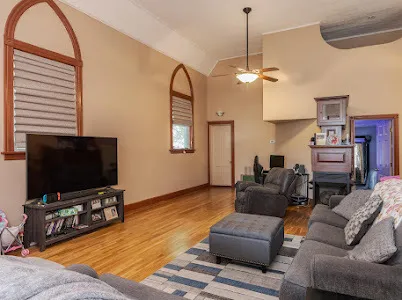 a living room with furniture and a flat screen tv