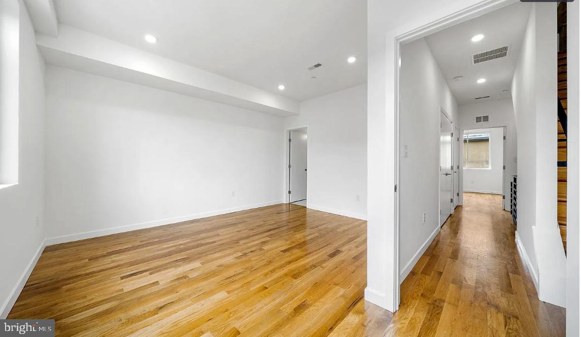 300 Budd Street, Unit D2 Philadelphia, PA 19104 - Photo 19 of 23 a view of a room with wooden floor and a bathroom