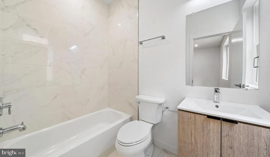 300 Budd Street, Unit D2 Philadelphia, PA 19104 - Photo 20 of 23 a bathroom with a sink a toilet and shower