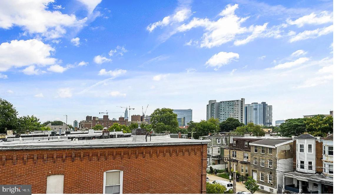 300 Budd Street, Unit D2 Philadelphia, PA 19104 - Photo 4 of 23 a view of a city with lawn chairs
