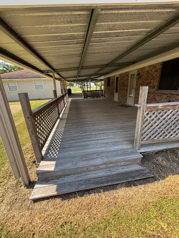 a view of outdoor space with wooden floor