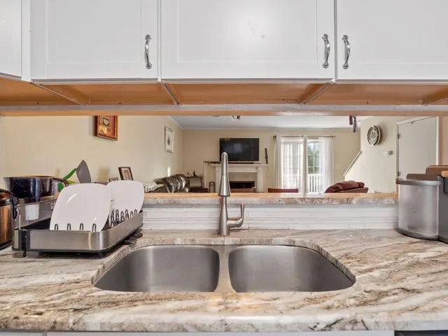 a kitchen with a sink and a refrigerator