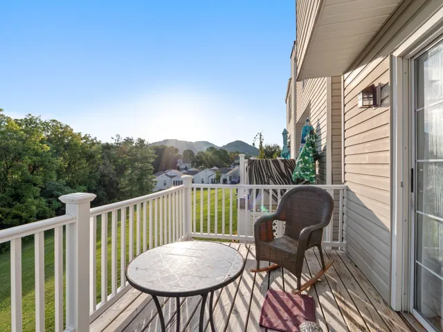 a view of balcony with furniture