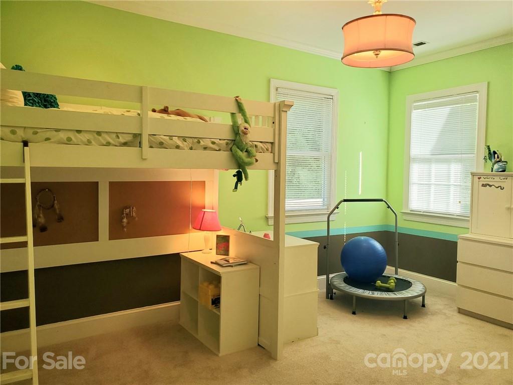 143 Morrison Hill Road Davidson, NC 28036 - Photo 11 of 17 a room with furniture and gym equipment