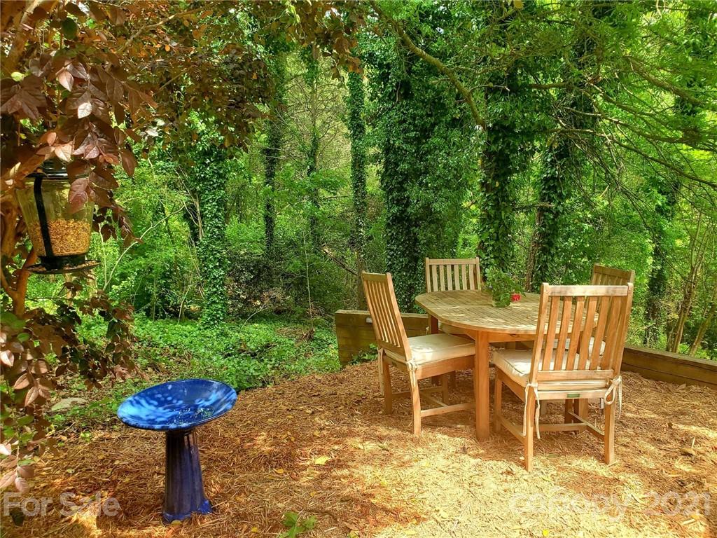 143 Morrison Hill Road Davidson, NC 28036 - Photo 14 of 17 a table and chairs in a garden
