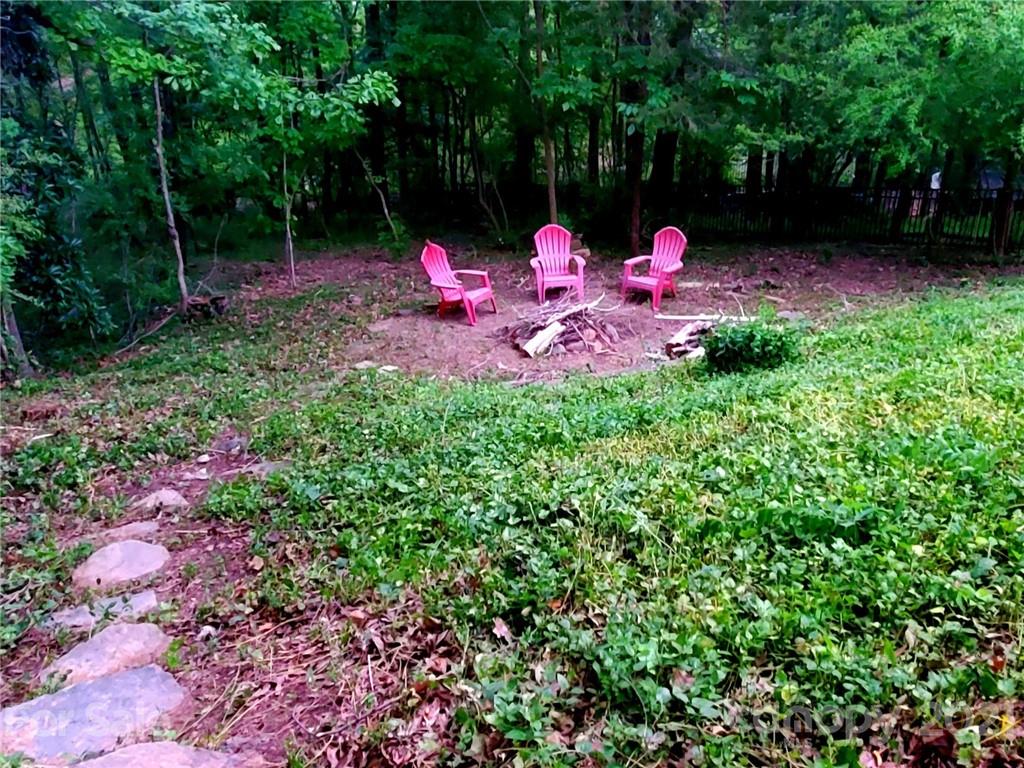 143 Morrison Hill Road Davidson, NC 28036 - Photo 15 of 17 a view of a backyard with sitting area