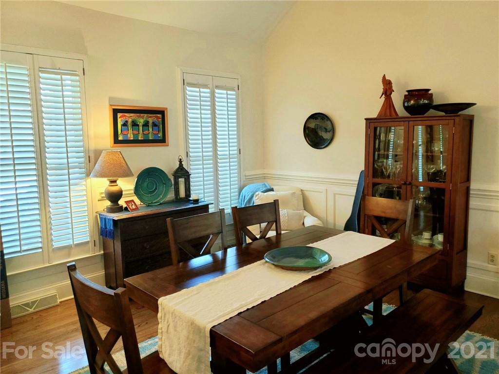 143 Morrison Hill Road Davidson, NC 28036 - Photo 9 of 17 a view of a dining room with furniture and wooden floor