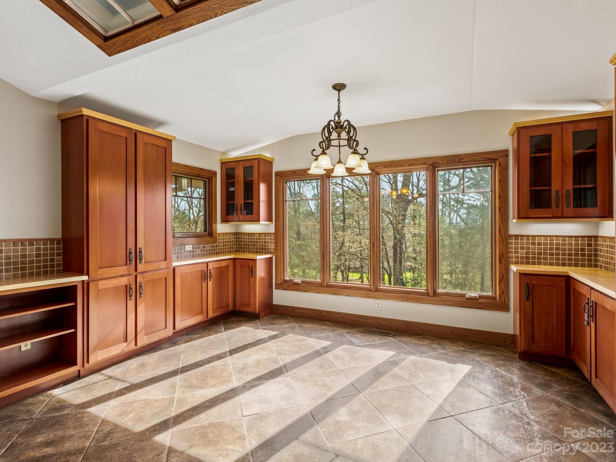 122 Emmas Grove Road Fletcher, NC 28732 - Photo 12 of 48 a view of a kitchen with stainless steel appliances granite countertop a refrigerator and a sink