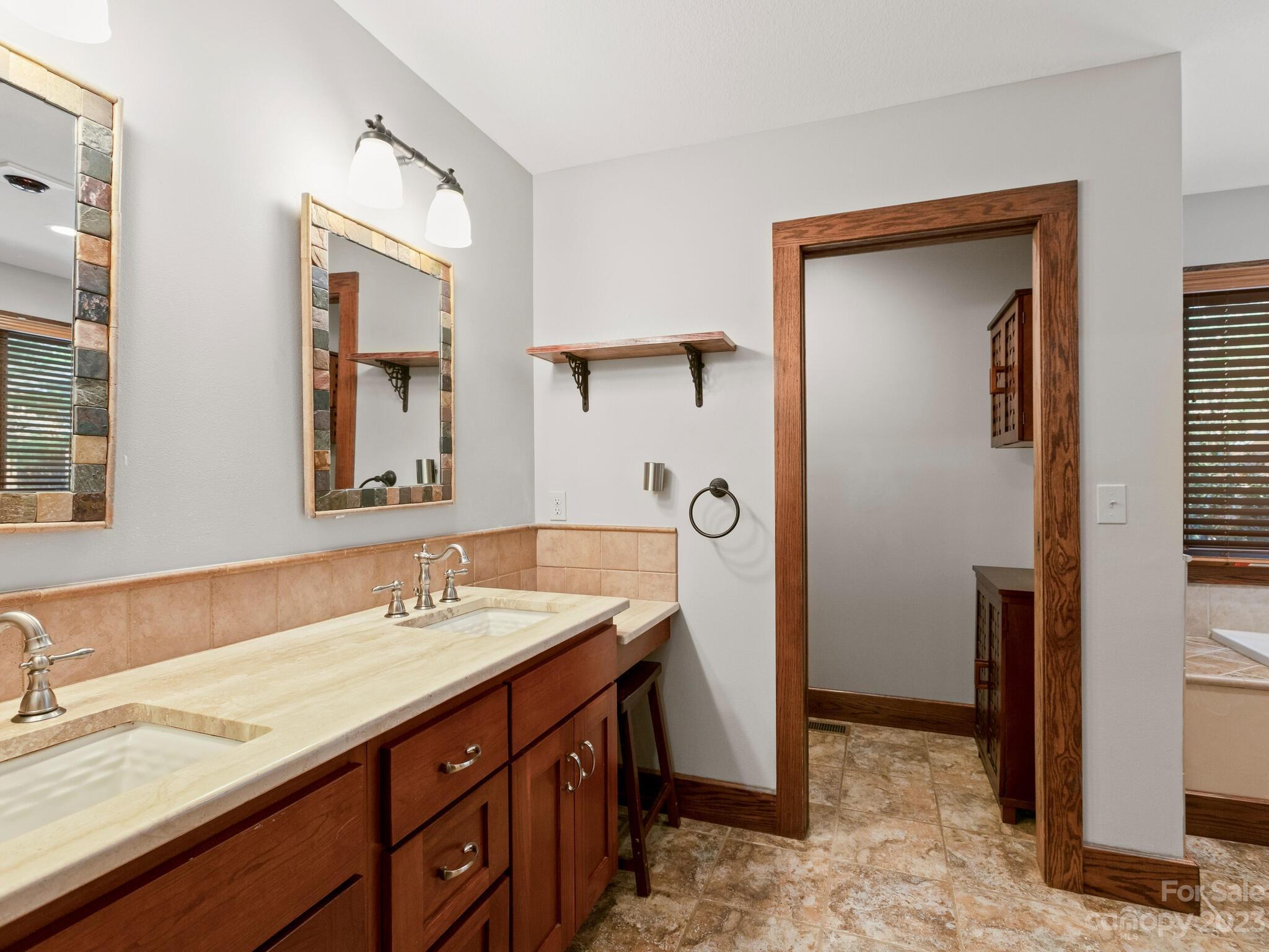 122 Emmas Grove Road Fletcher, NC 28732 - Photo 15 of 48 a bathroom with a sink and a mirror