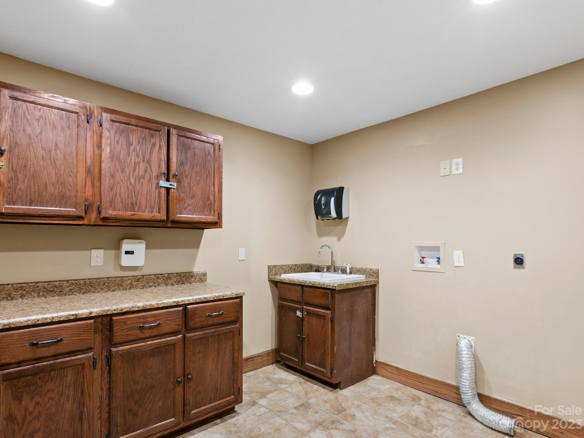 122 Emmas Grove Road Fletcher, NC 28732 - Photo 19 of 48 a kitchen with stainless steel appliances granite countertop a sink stove and cabinets