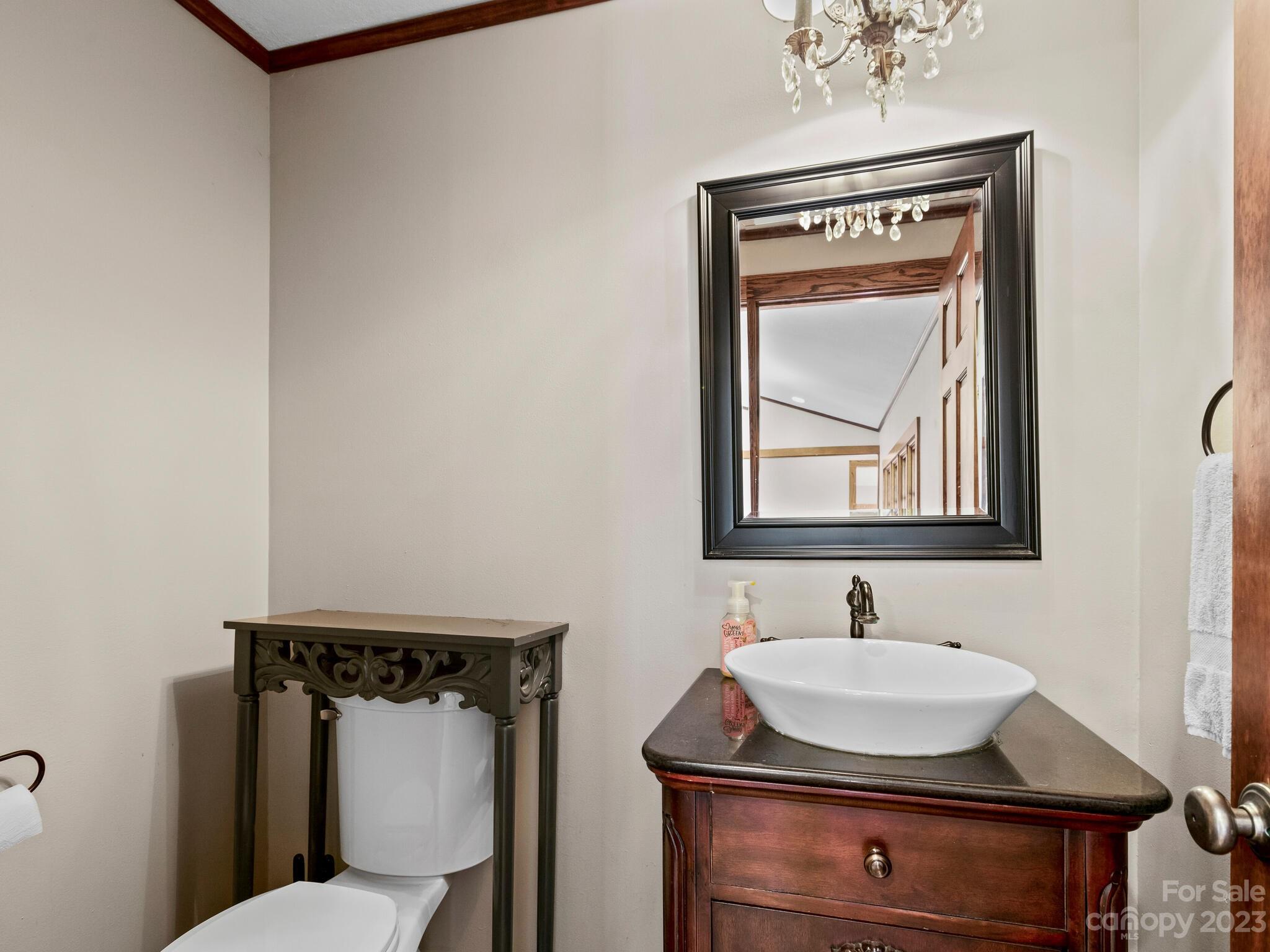 122 Emmas Grove Road Fletcher, NC 28732 - Photo 22 of 48 a bathroom with a sink toilet and mirror