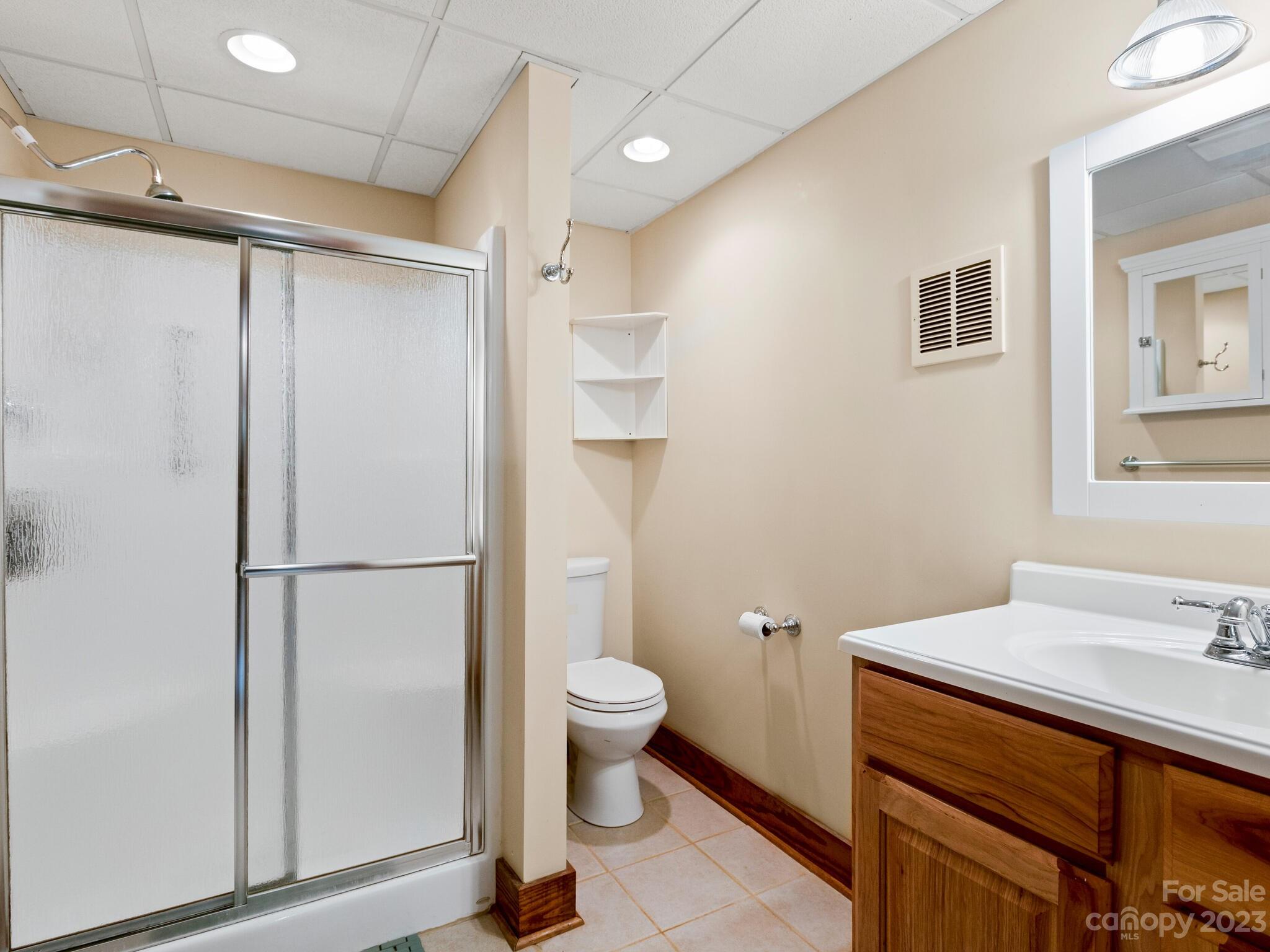 122 Emmas Grove Road Fletcher, NC 28732 - Photo 27 of 48 a bathroom with a sink toilet and shower