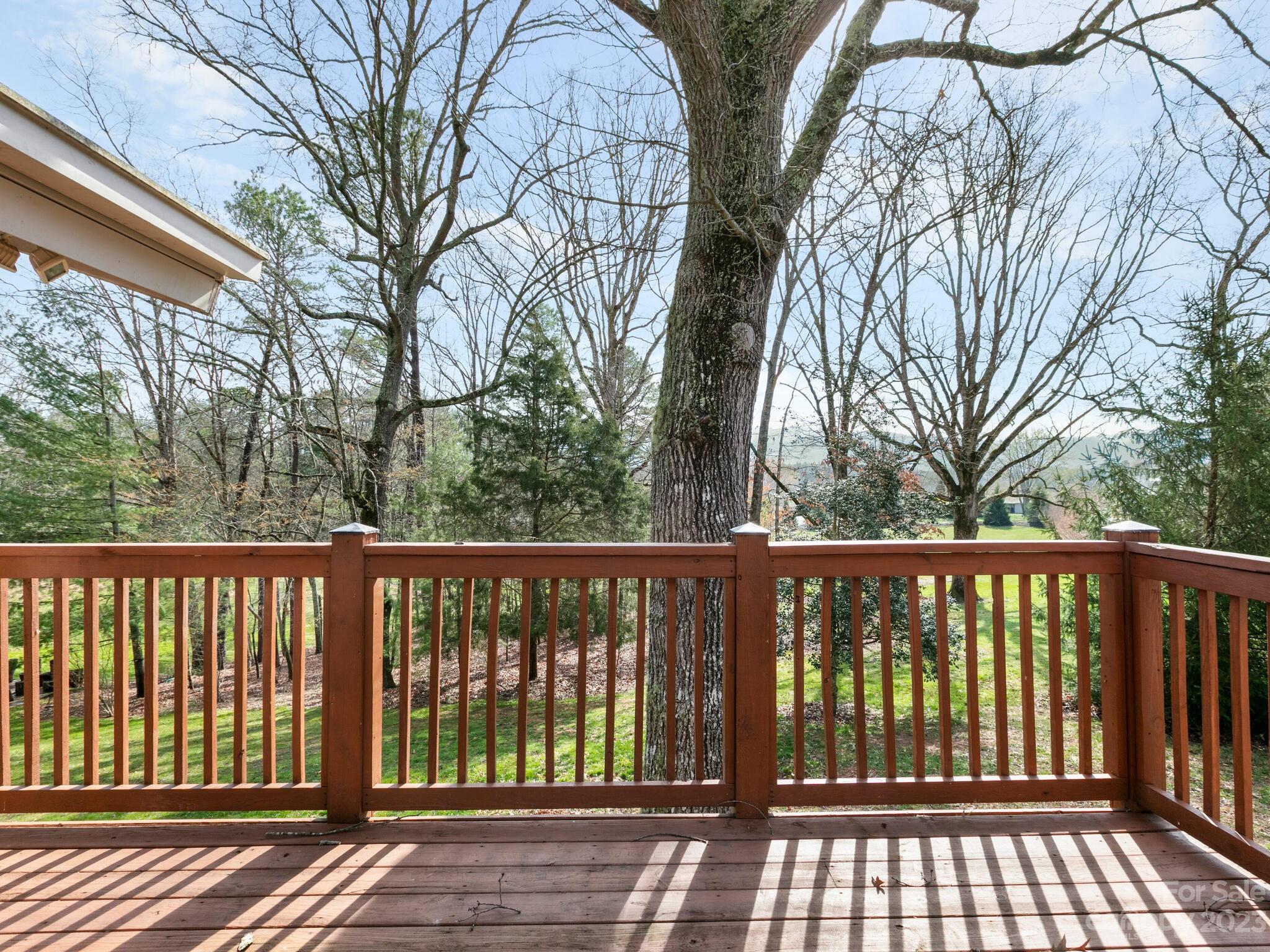 122 Emmas Grove Road Fletcher, NC 28732 - Photo 30 of 48 a balcony with wooden floor and fence