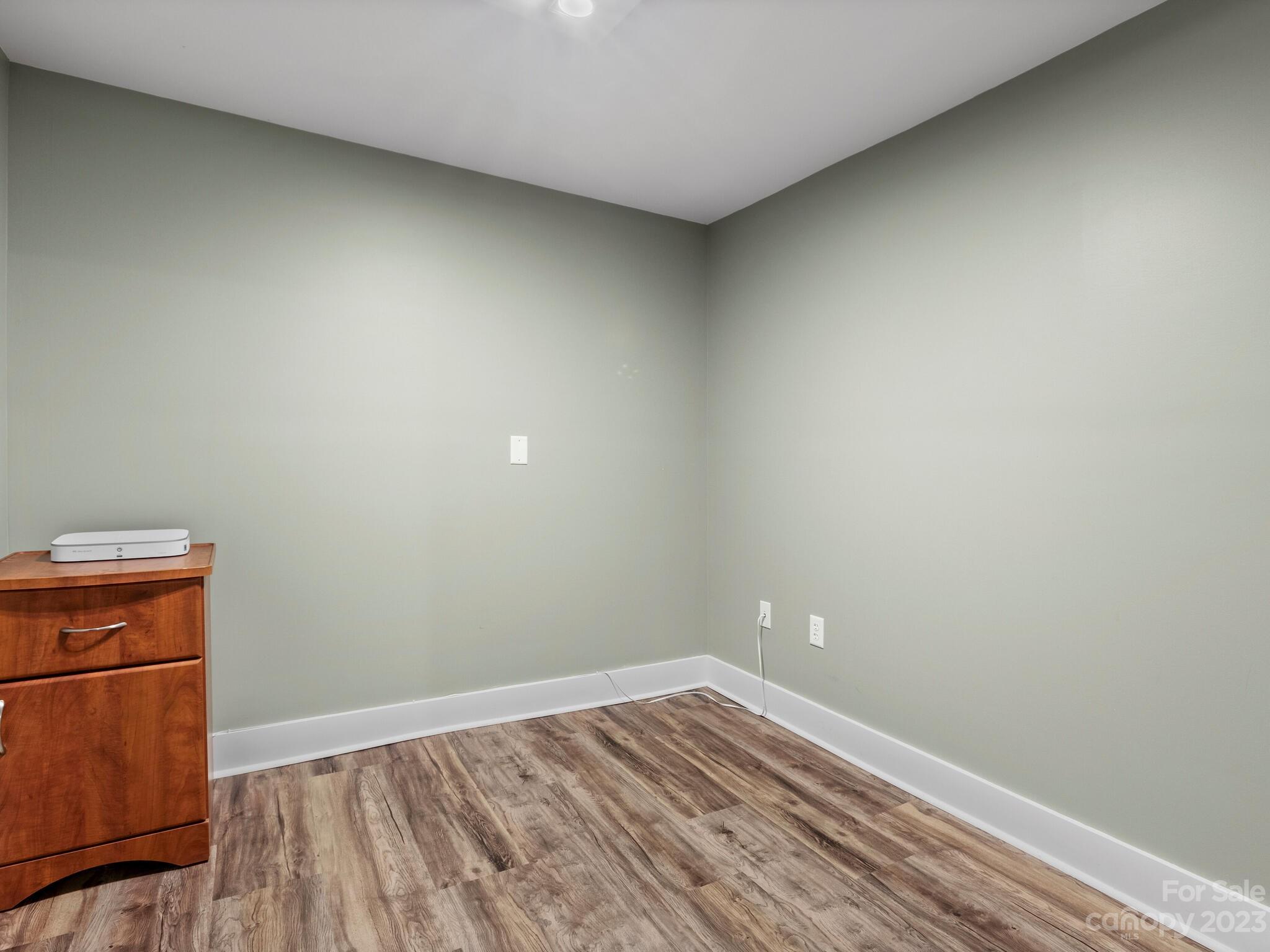 122 Emmas Grove Road Fletcher, NC 28732 - Photo 38 of 48 a view of empty room with wooden floor