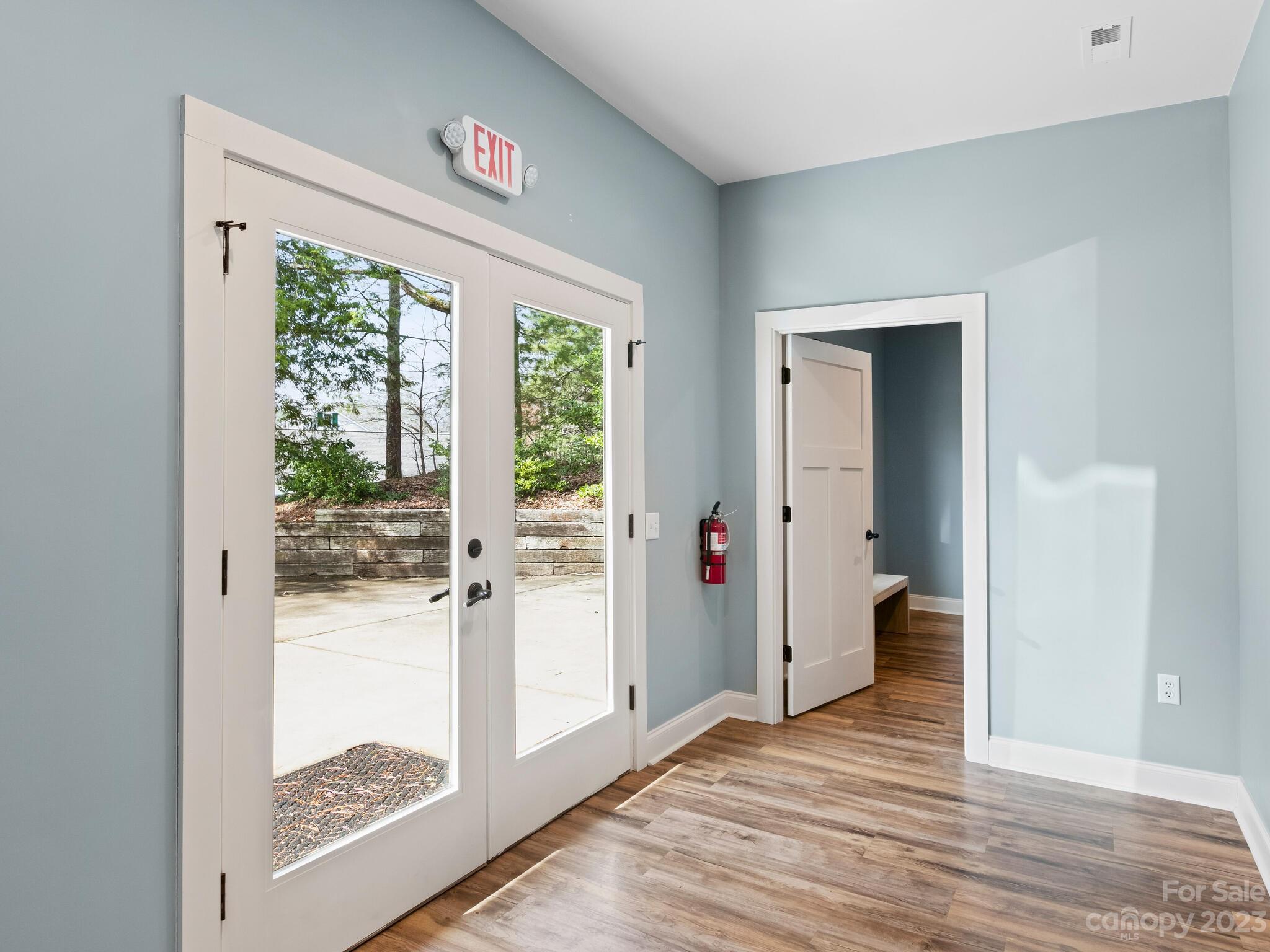 122 Emmas Grove Road Fletcher, NC 28732 - Photo 40 of 48 a view of a hallway with wooden floor and a living room