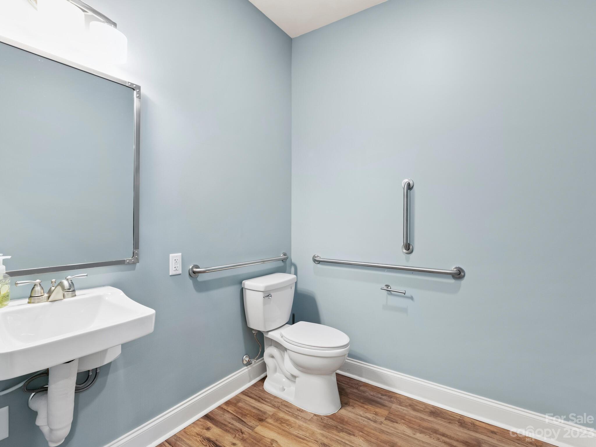 122 Emmas Grove Road Fletcher, NC 28732 - Photo 44 of 48 a bathroom with a toilet a sink and mirror