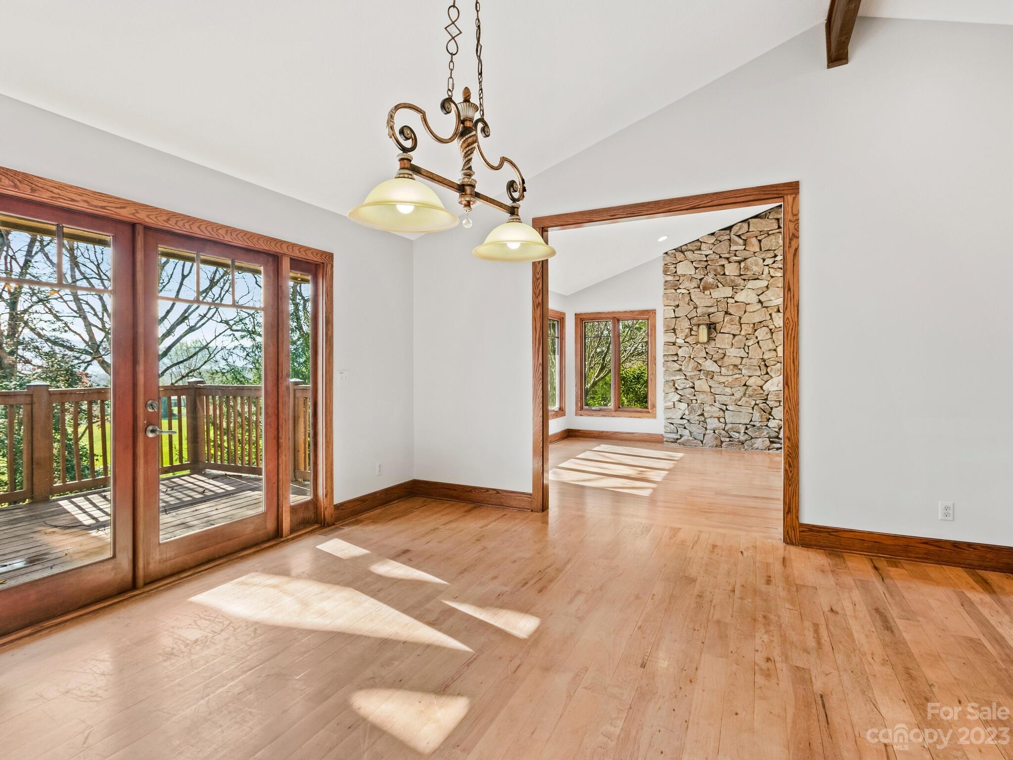 122 Emmas Grove Road Fletcher, NC 28732 - Photo 8 of 48 a view of an empty room with a window and wooden floor