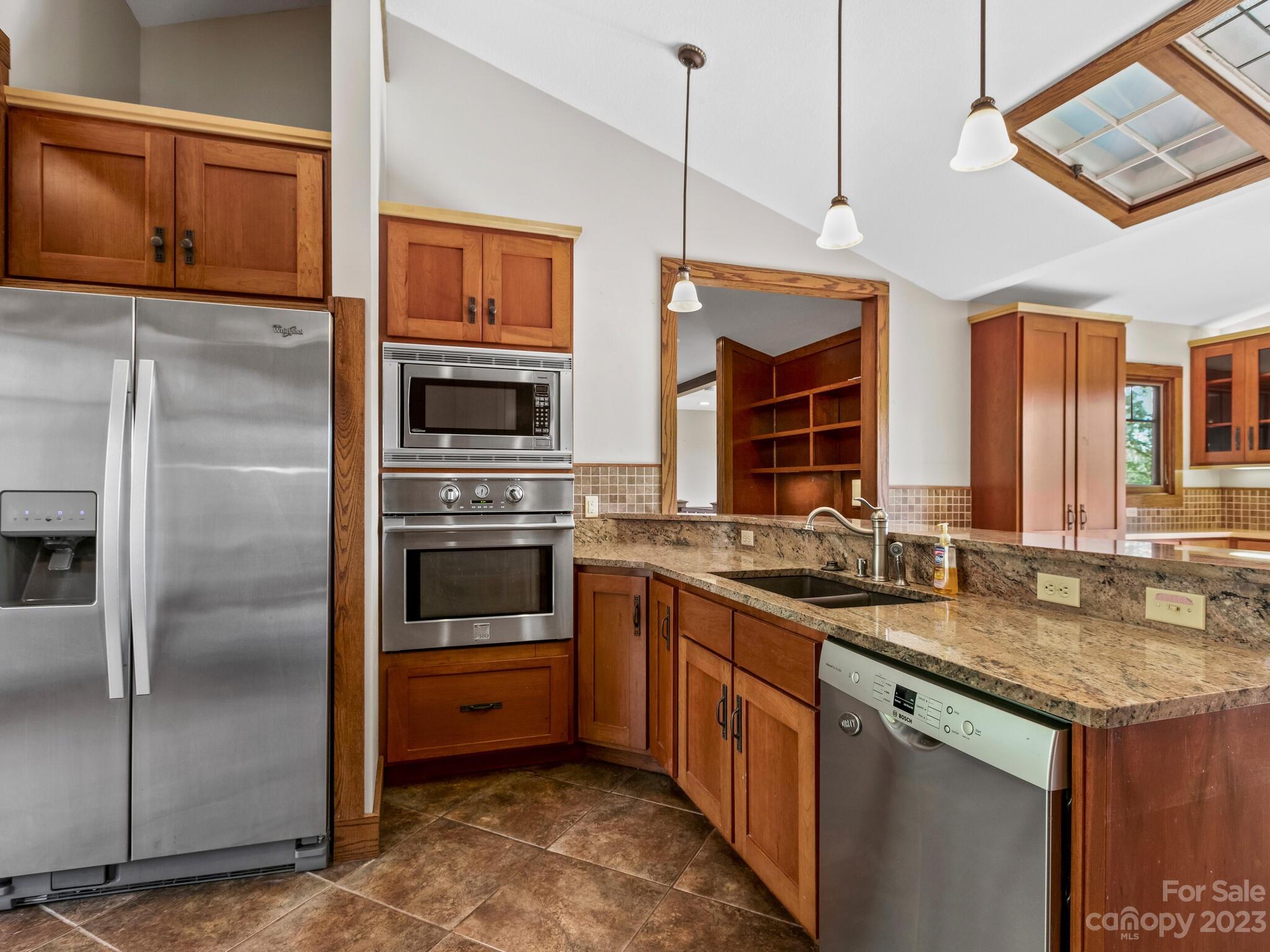122 Emmas Grove Road Fletcher, NC 28732 - Photo 10 of 48 a kitchen with a sink stove and refrigerator