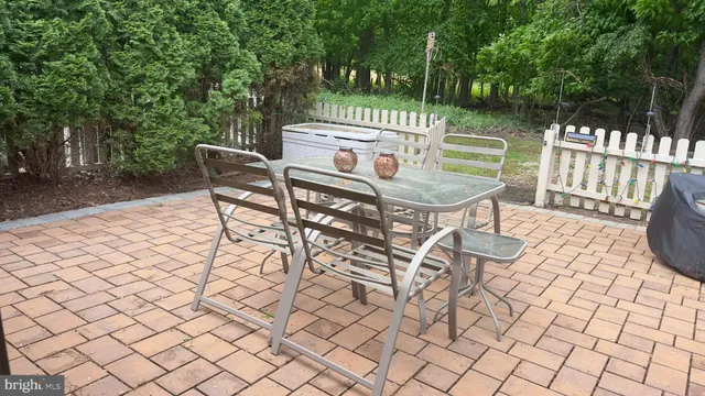 a view of a chairs and table in the patio
