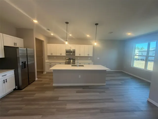 a bathroom with a sink mirror and a bathtub