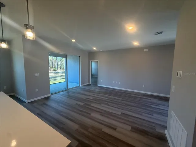 a view of kitchen with wooden floor