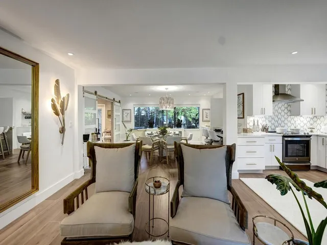a bathroom with double vanity sinks and a mirror