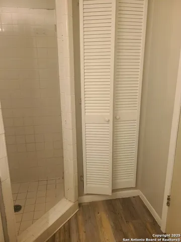 an empty room with a empty space and windows