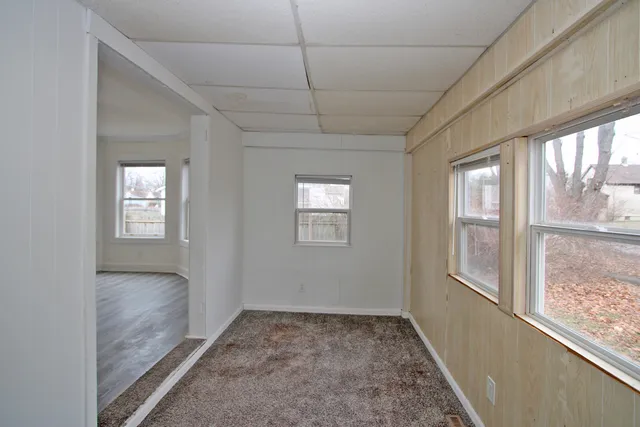 a view of hallway with windows