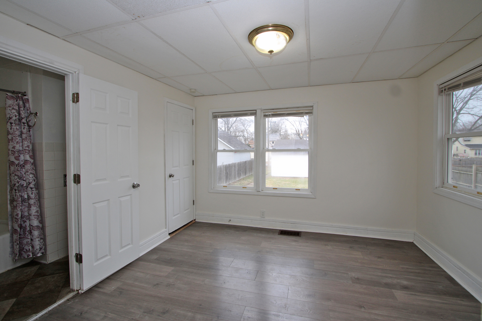 3013 Elim Avenue Zion, IL 60099 - Photo 15 of 36 an empty room with wooden floor and windows