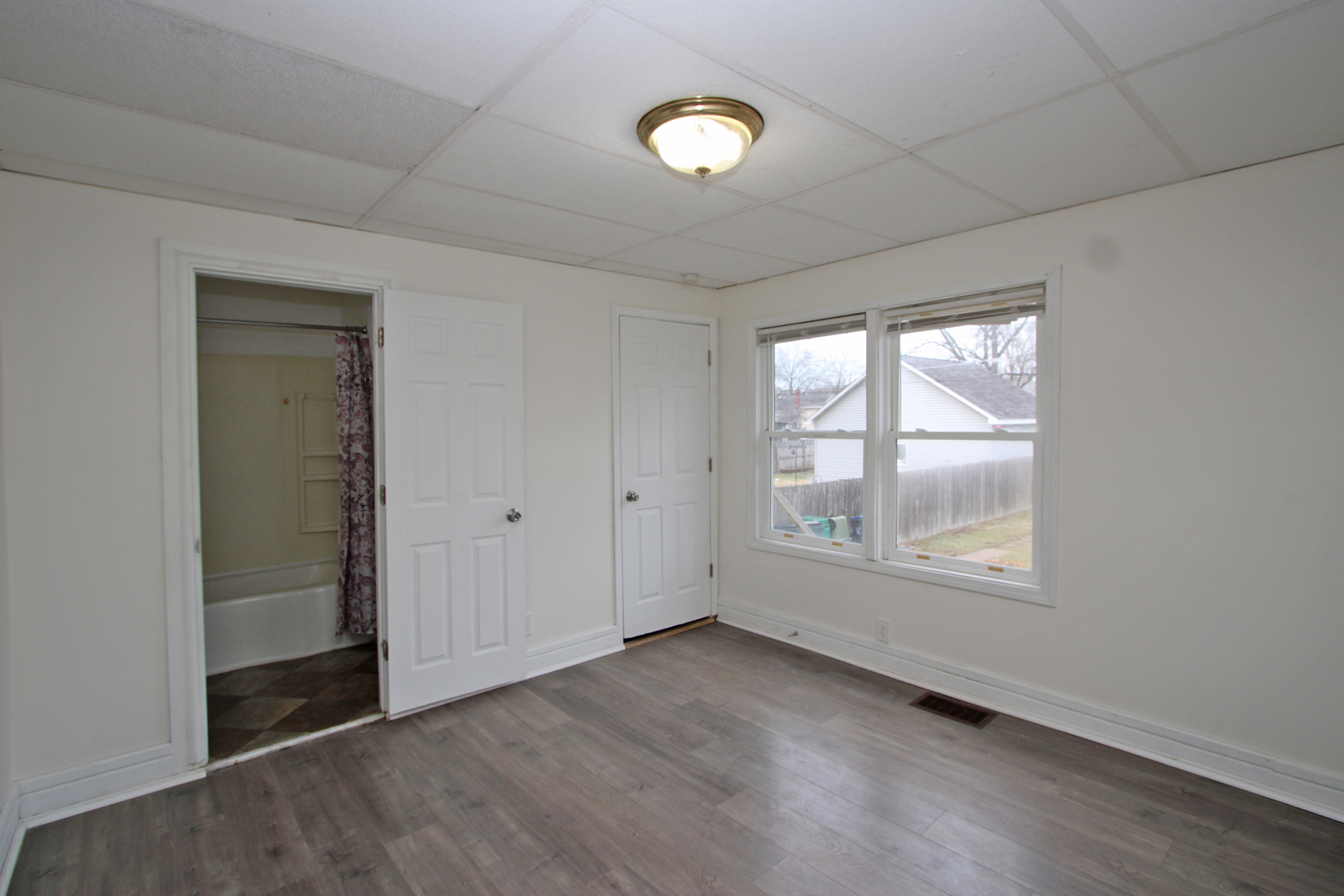 3013 Elim Avenue Zion, IL 60099 - Photo 16 of 36 an empty room with wooden floor and windows
