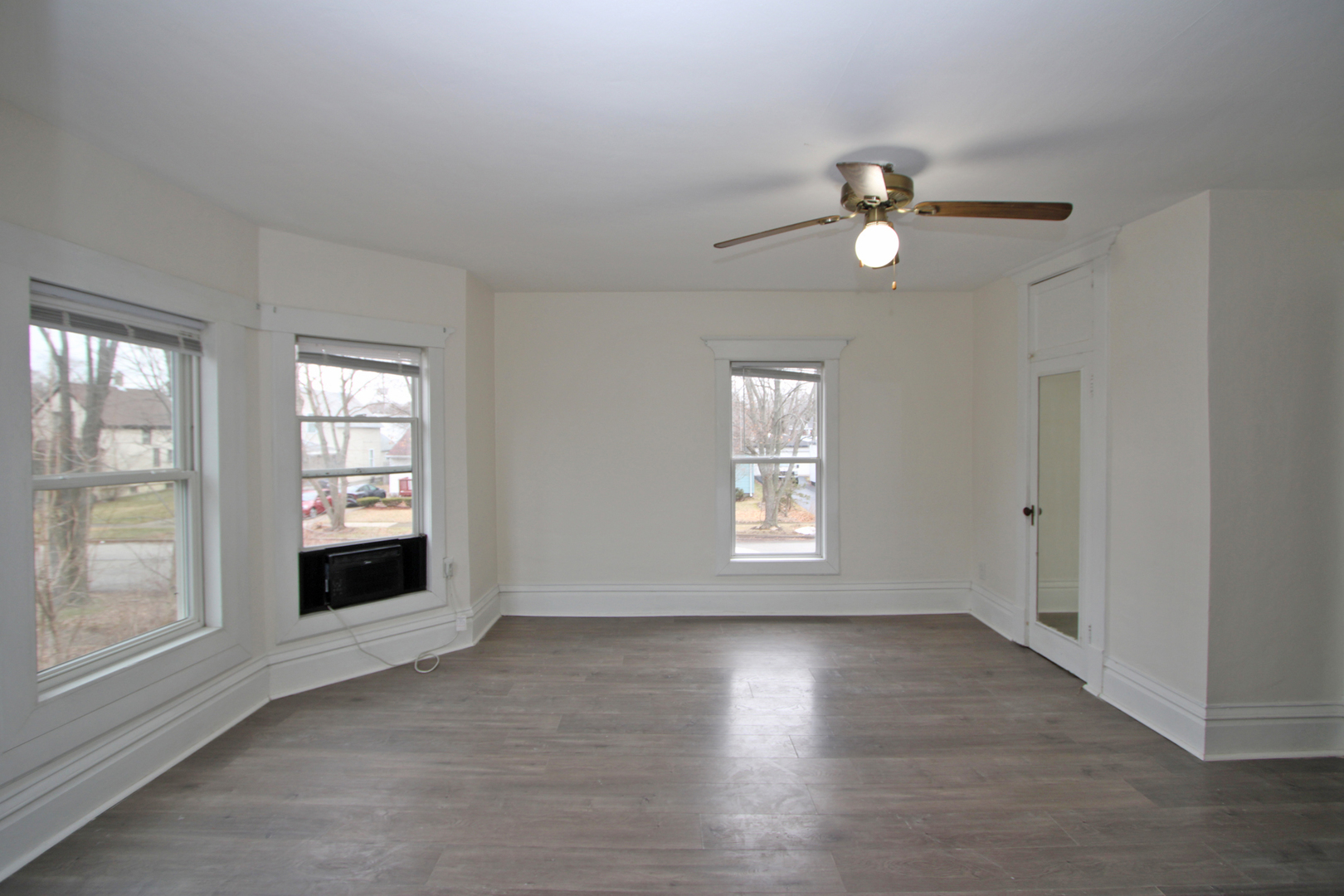 3013 Elim Avenue Zion, IL 60099 - Photo 26 of 36 a view of an empty room with a window and wooden floor