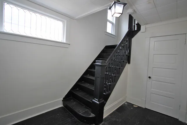 a view of entryway with wooden floor