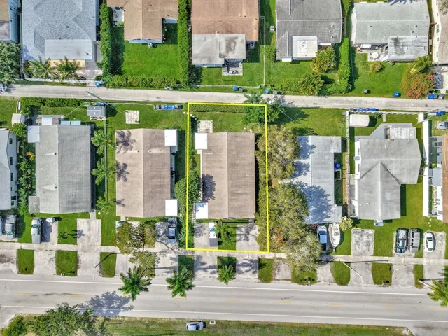 front view of a building with a garden