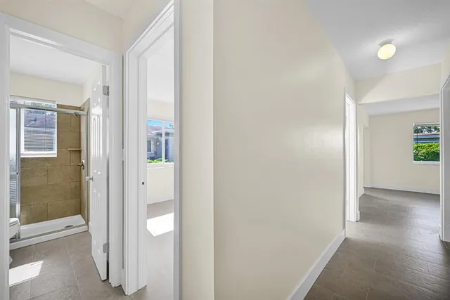 a view of a bathroom from a hallway